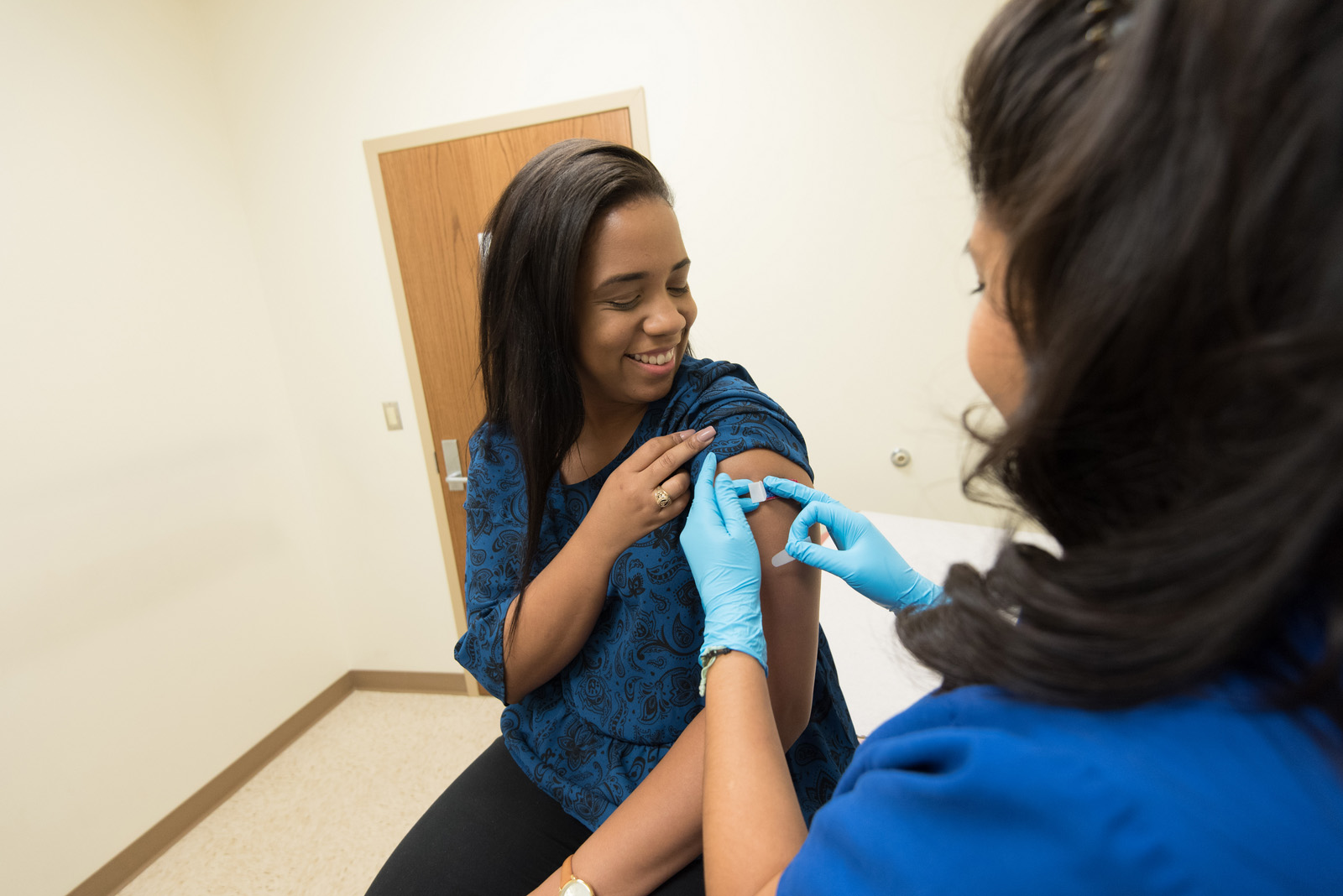A student receiving care from a nurse on campus.