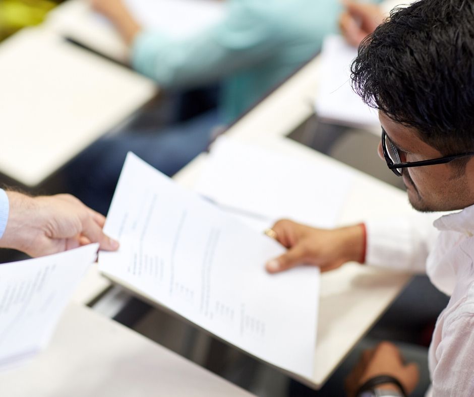 Student holding papers