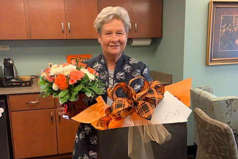Regina Henry with a gift presented at the ceremony