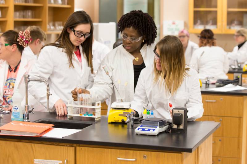 three scientists in a lab
